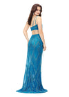 Back view. Turquoise ASHLEYlauren 11280 daring one shoulder gown featuring an intricate bead pattern, scattered fringe accents, bold side cut outs, and a left leg slit for a striking and glamorous statement look.