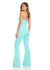 Back - Chic and sophisticated strapless scuba jumpsuit featuring a perfectly tailored fit, an asymmetrical bustier, and a sleek belt for a polished and modern look. Perfect for making a statement at any event.