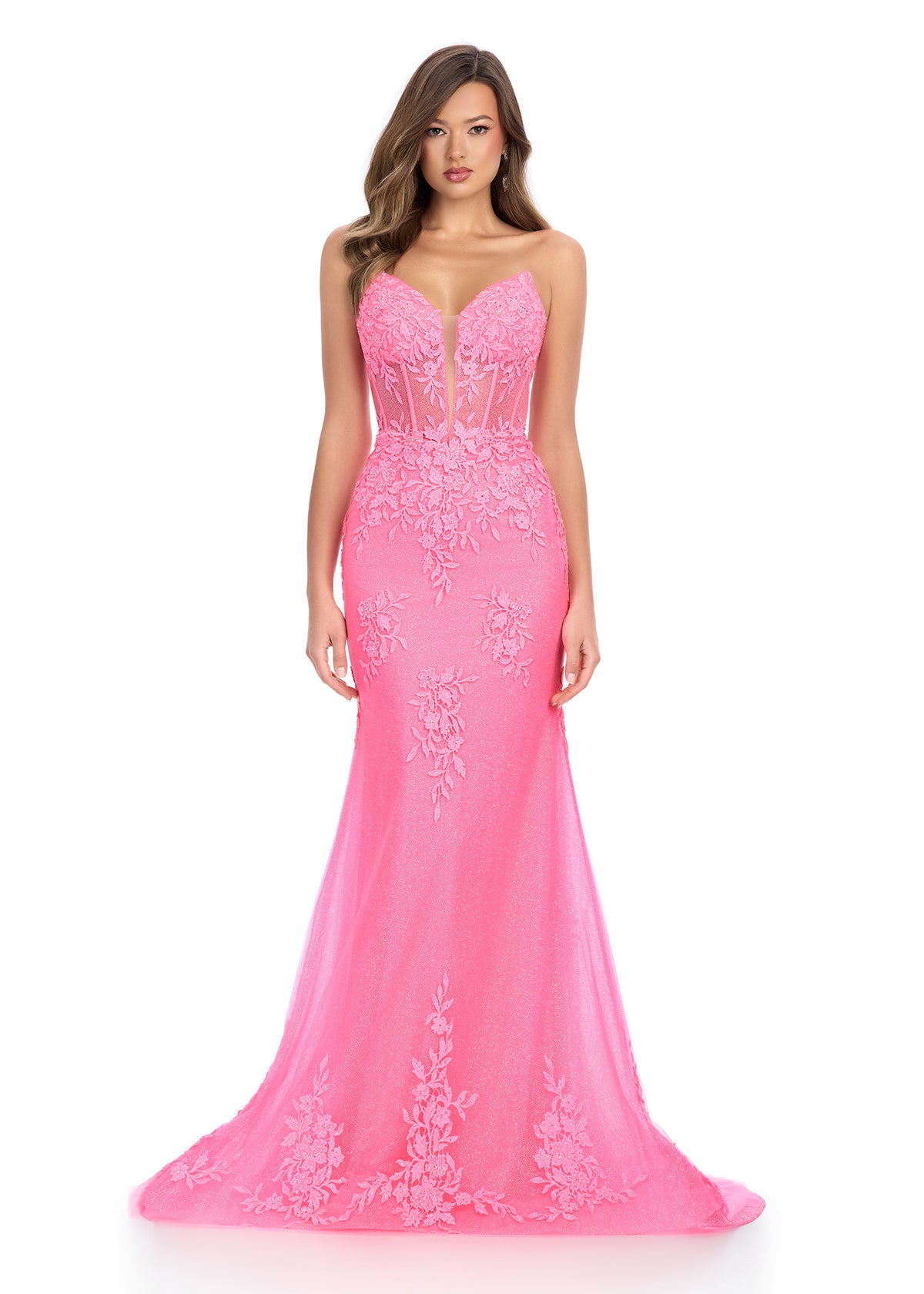 Dance the night away in this stunning gown featuring a sweetheart neckline, a structured corset bustier, and delicate floral tulle appliqué that cascades down the bodice and skirt for a romantic and elegant look. Perfect for special occasions.