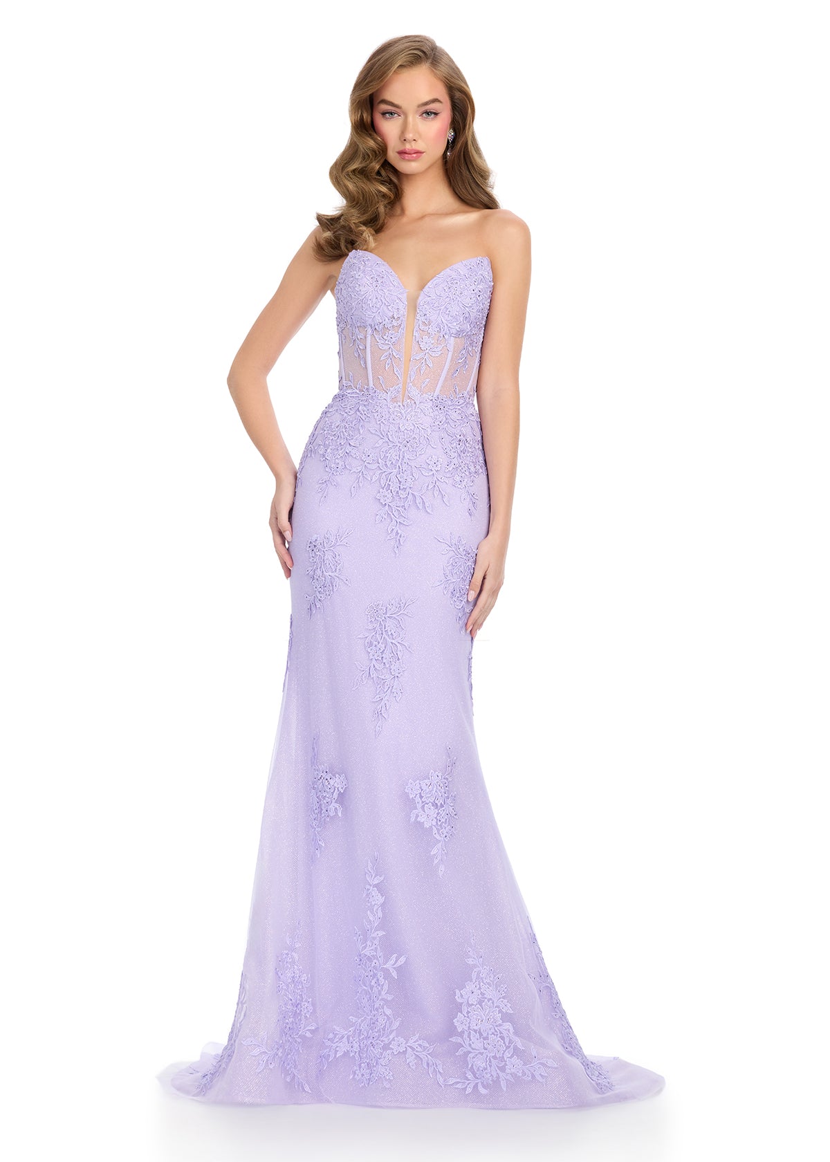 Dance the night away in this stunning gown featuring a sweetheart neckline, a structured corset bustier, and delicate floral tulle appliqué that cascades down the bodice and skirt for a romantic and elegant look. Perfect for special occasions.