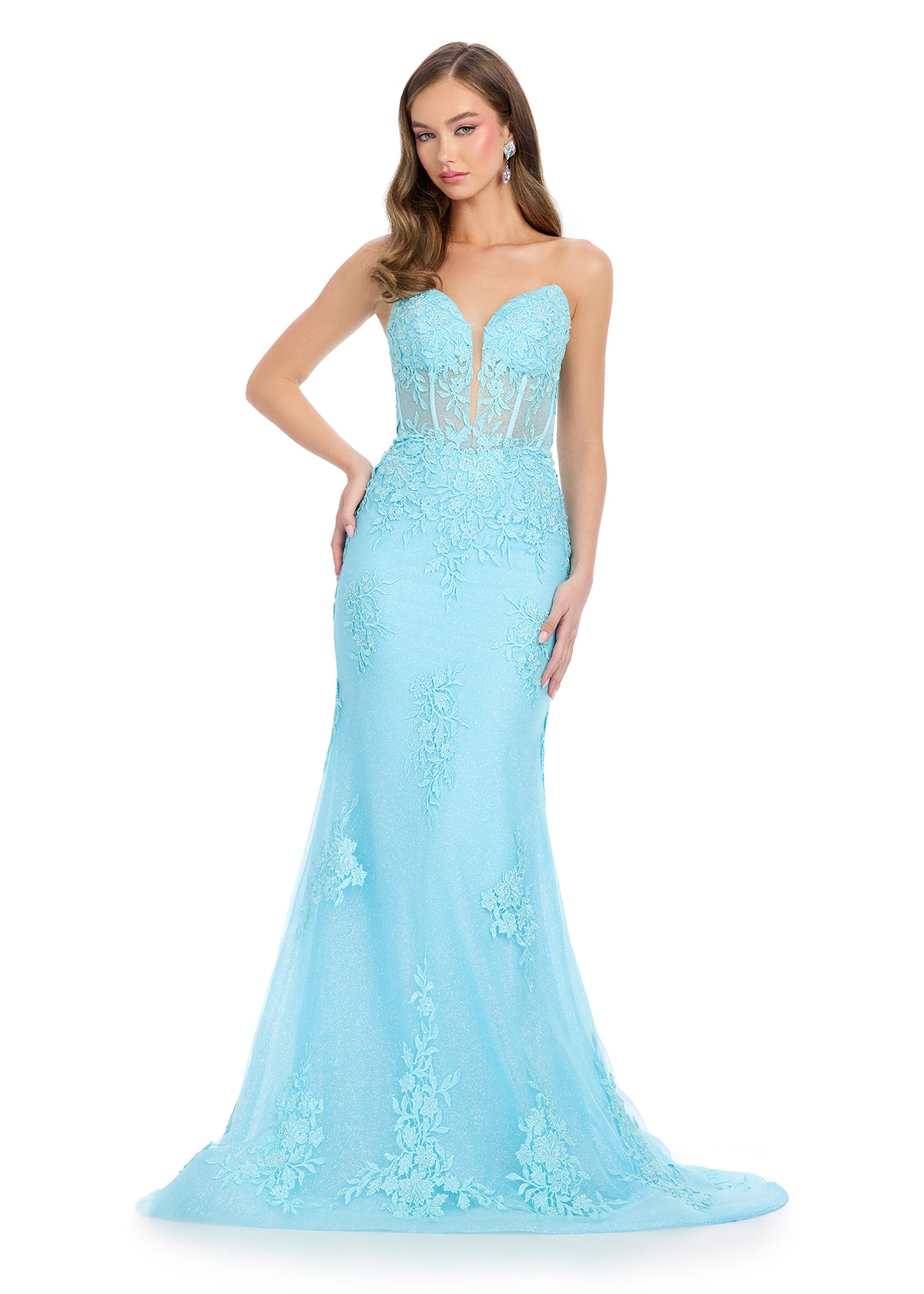 Dance the night away in this stunning gown featuring a sweetheart neckline, a structured corset bustier, and delicate floral tulle appliqué that cascades down the bodice and skirt for a romantic and elegant look. Perfect for special occasions.