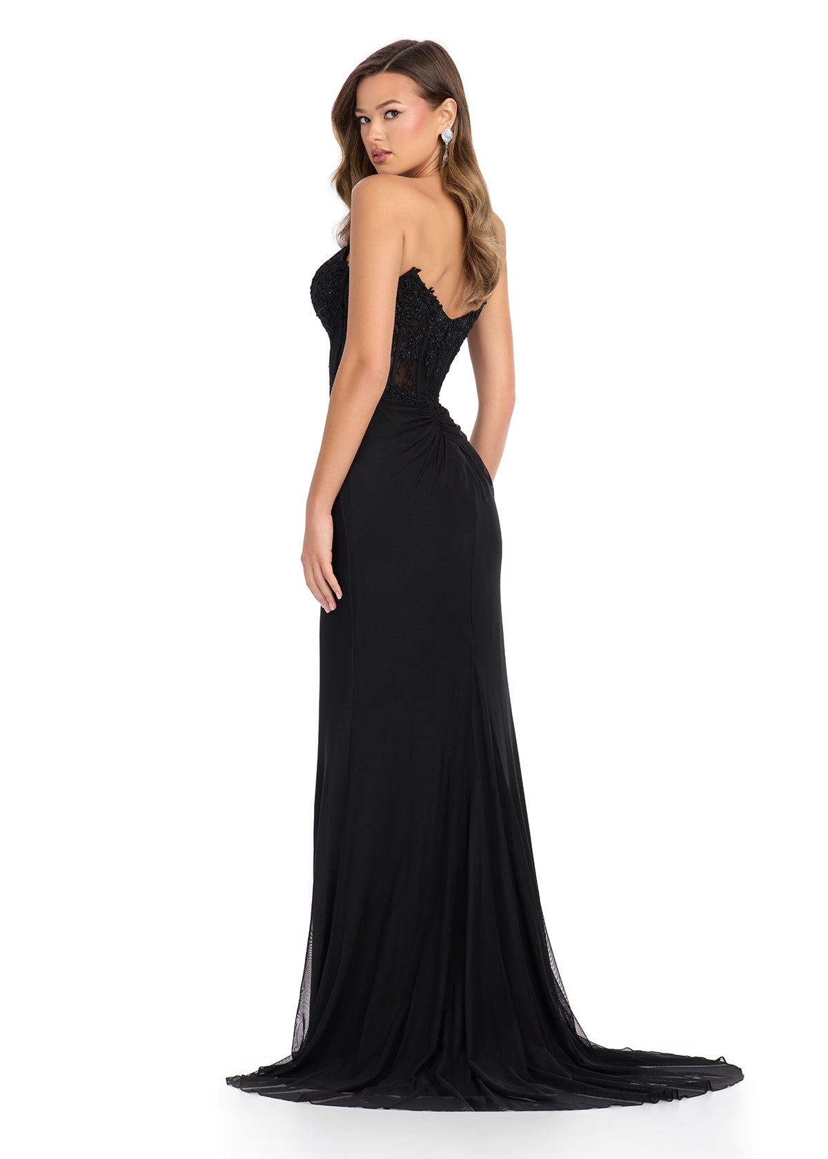 Back - Statement-making gown featuring a structured corset bustier adorned with intricate embroidered appliqué, a ruffle-accented right leg slit, and a sweep train for a glamorous and elegant finish. Perfect for special occasions.