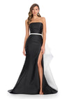 Elegant strapless mikado gown featuring a sleek belt, a left leg slit, and a statement back bow that cascades down onto the sweep train for a dramatic and sophisticated finish. Perfect for special occasions.