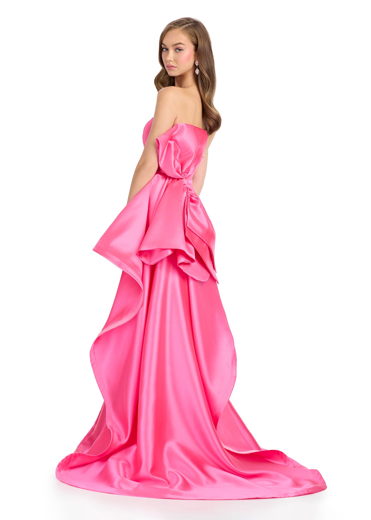 Back -  Elegant strapless mikado gown featuring a sleek belt, a left leg slit, and a statement back bow that cascades down onto the sweep train for a dramatic and sophisticated finish. Perfect for special occasions.