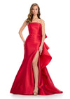 Elegant strapless mikado gown featuring a sleek belt, a left leg slit, and a statement back bow that cascades down onto the sweep train for a dramatic and sophisticated finish. Perfect for special occasions.