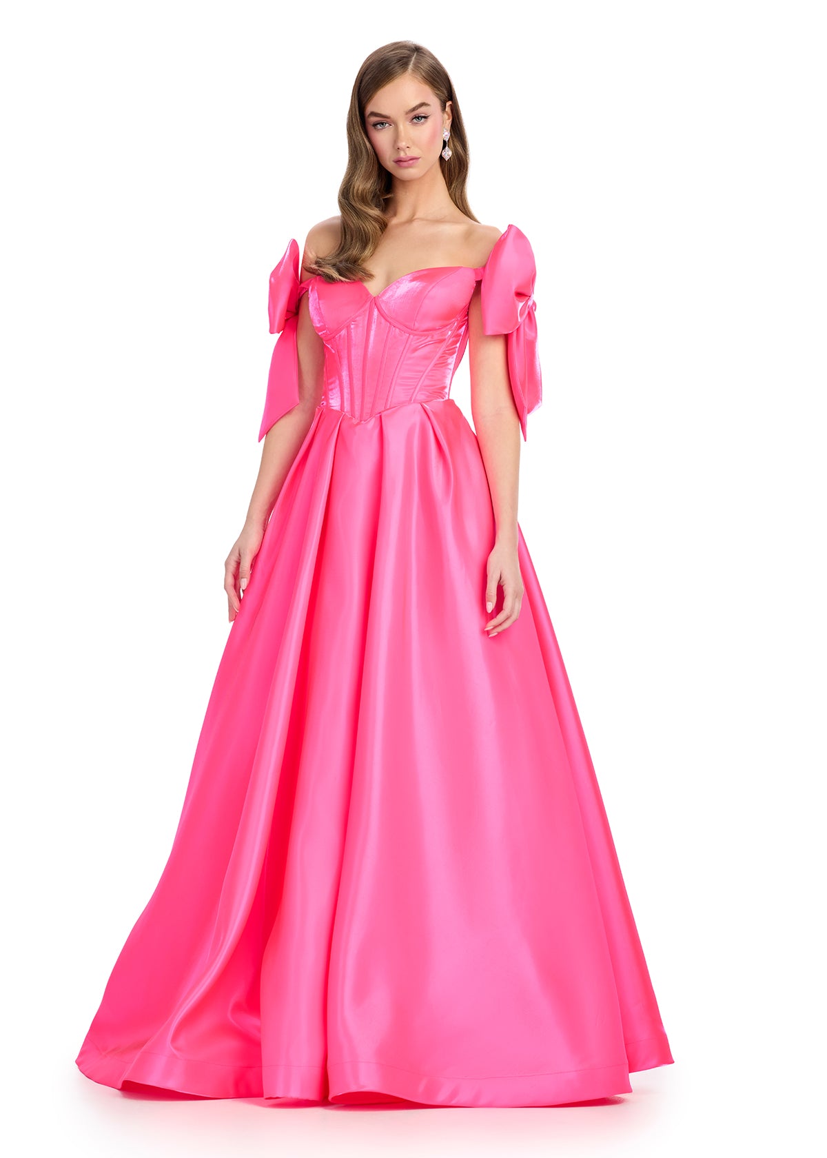 Regal satin ball gown featuring a structured corset bustier, a flattering sweetheart neckline, and elegant off-the-shoulder bow straps. Finished with a voluminous skirt for a timeless princess look. Perfect for special occasions.