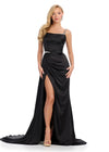 legantly draped gown featuring delicate spaghetti straps, asymmetrical beaded detailing, and a wrap skirt. Finished with a right leg slit and sweep train for a sophisticated and glamorous look. Perfect for special occasions.