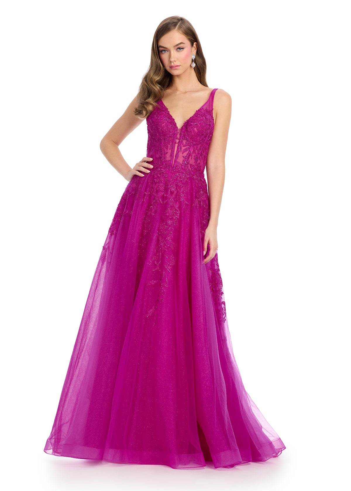 Elegant tulle ball gown featuring a V-neckline, scoop back, and intricate embroidered appliqué adorning the bustier and cascading down the A-line skirt. Finished with a sweep train for a regal touch. Perfect for making a grand entrance.