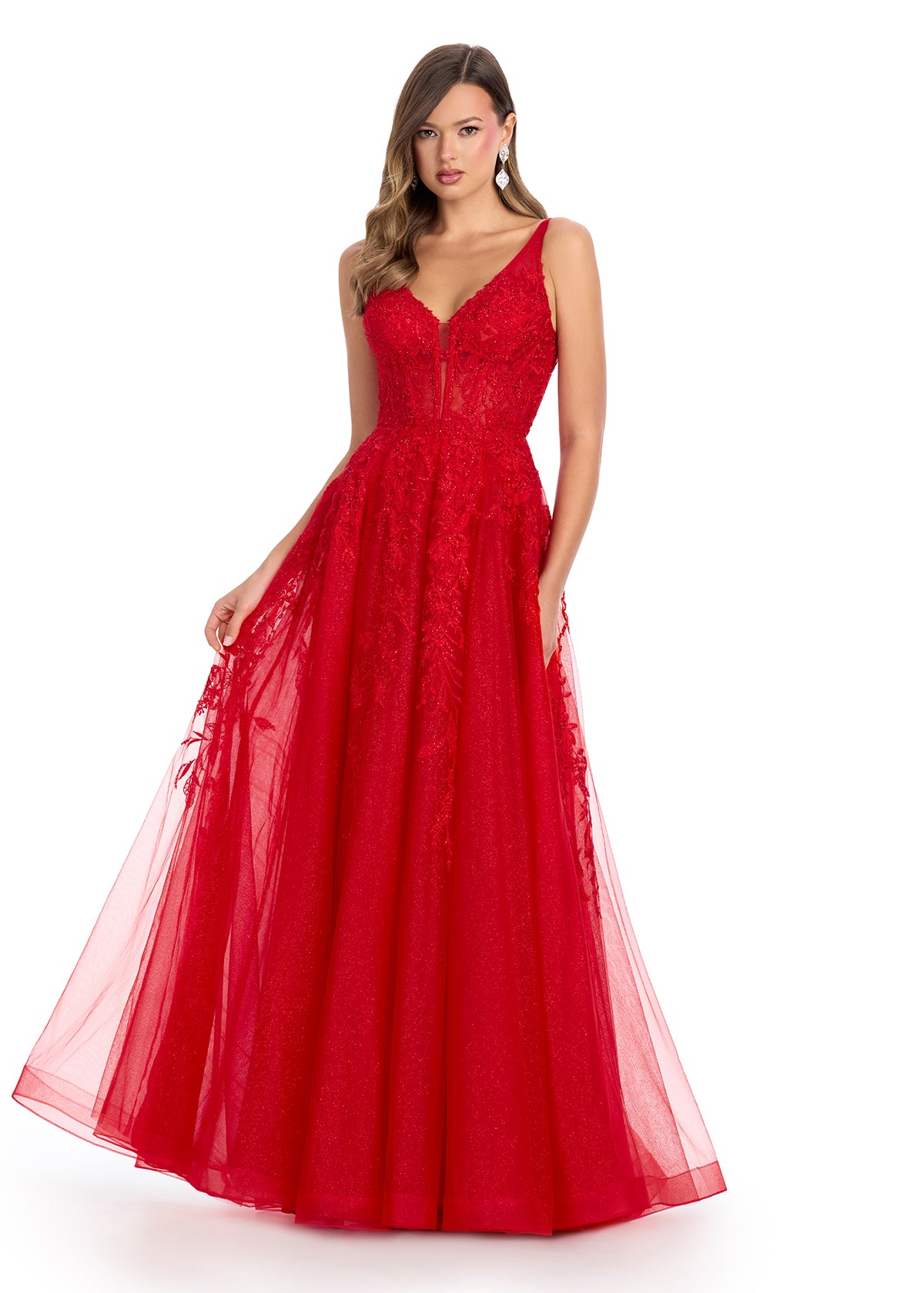 Elegant tulle ball gown featuring a V-neckline, scoop back, and intricate embroidered appliqué adorning the bustier and cascading down the A-line skirt. Finished with a sweep train for a regal touch. Perfect for making a grand entrance.