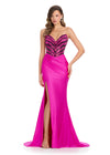 Sparkling strapless gown featuring a structured bustier adorned with press-on stones in an animal print-inspired pattern. Complete with a wrap skirt, right leg slit, and sweep train for a fierce and glamorous look. Perfect for special occasions.