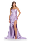 Sleek metallic jersey gown featuring delicate spaghetti straps, a lace-up back, a ruched wrap skirt, and a left leg slit for a shimmering, figure-flattering look. Perfect for any special event.