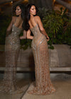 Back -  Iconic fully beaded fitted gown featuring delicate spaghetti straps, a plunging V-neckline, and intricate hand-beaded patterns that shimmer with every movement. Designed to accentuate your curves for a showstopping look.