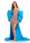 Statement-making off-shoulder cape featuring an oversized bow and flowing overskirt. The perfect accessory to elevate your prom or pageant look with elegance and drama.