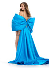 Statement-making off-shoulder cape featuring an oversized bow and flowing overskirt. The perfect accessory to elevate your prom or pageant look with elegance and drama.