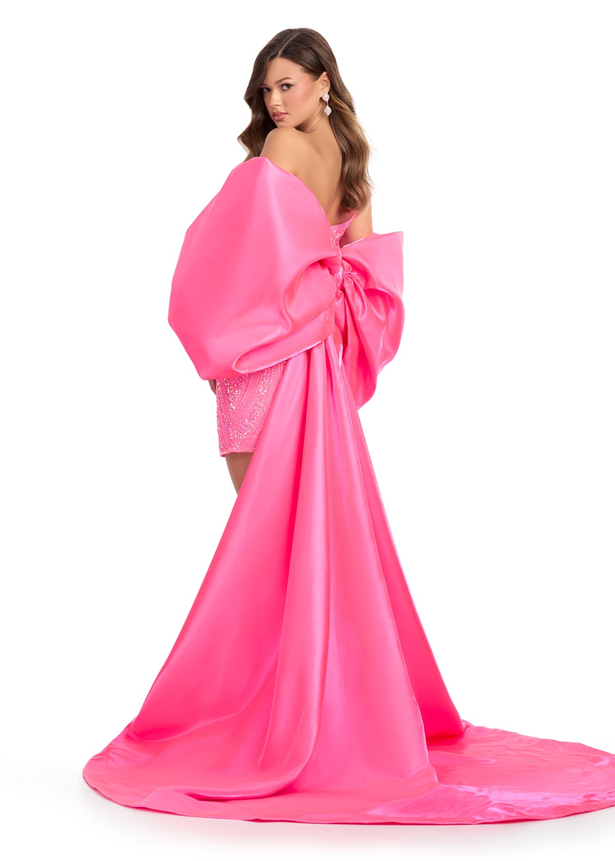 Statement-making off-shoulder cape featuring an oversized bow and flowing overskirt. The perfect accessory to elevate your prom or pageant look with elegance and drama.