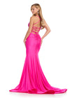 Statement-making jersey gown featuring a corset bustier, illusion V-neckline, asymmetrical waist, and shimmering press-on stones. Finished with a lace-up back for a perfect fit. Ideal for prom and special occasions.