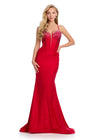 Statement-making jersey gown featuring a corset bustier, illusion V-neckline, asymmetrical waist, and shimmering press-on stones. Finished with a lace-up back for a perfect fit. Ideal for prom and special occasions.