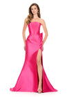 ASHLEYlauren 12215 | Fuchsia strapless mikado gown with structured bodice, bold high slit, and oversized bow ruffle back detail