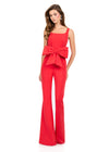 ASHLEYlauren 12242 | Red tailored scuba jumpsuit with square neckline, statement bow waist, and flared leg silhouette