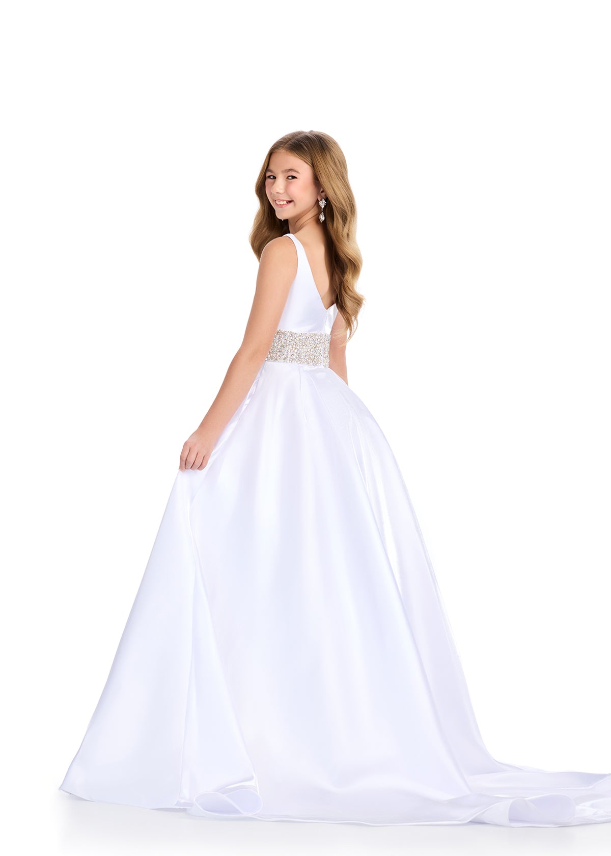 Back. White ASHLEYlauren 8276 satin kids ball gown featuring a scoop neckline, V-back, and a fully beaded waistband for an elegant and glamorous touch.