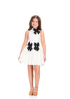 ASHLEYlauren 8411 Cocktail | Beautiful white dress with floral patterns high neck line with three show stopping bows