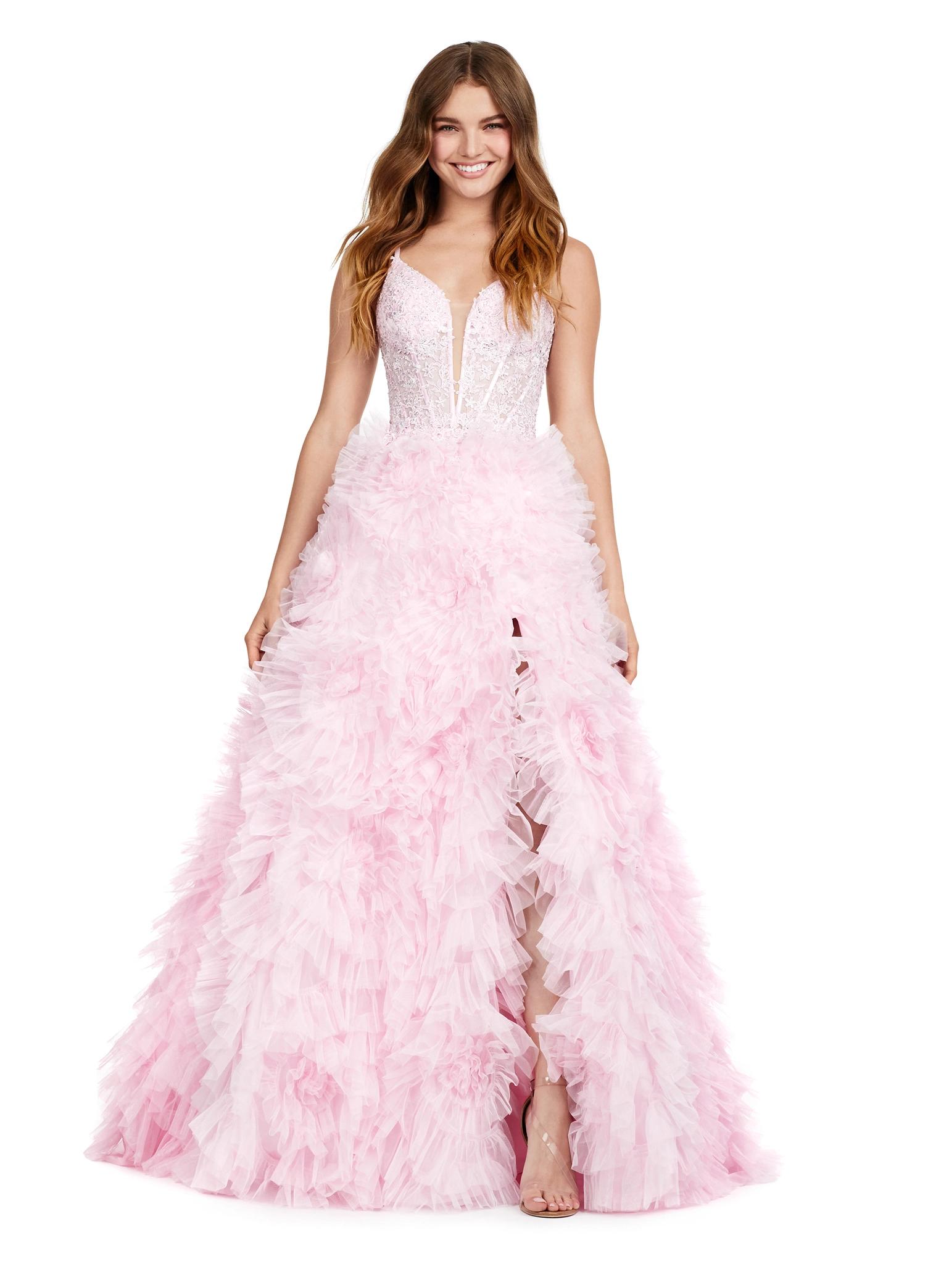 ASHLEYlauren 11446 blush pink tulle gown with ruffled A-line skirt, corset bustier, deep illusion V-neckline, and leg slit