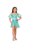 Aqua ASHLEYlauren 8233 fully beaded romper featuring delicate spaghetti straps, detachable puff sleeves, and a dramatic detachable overskirt for a fun and versatile statement look.