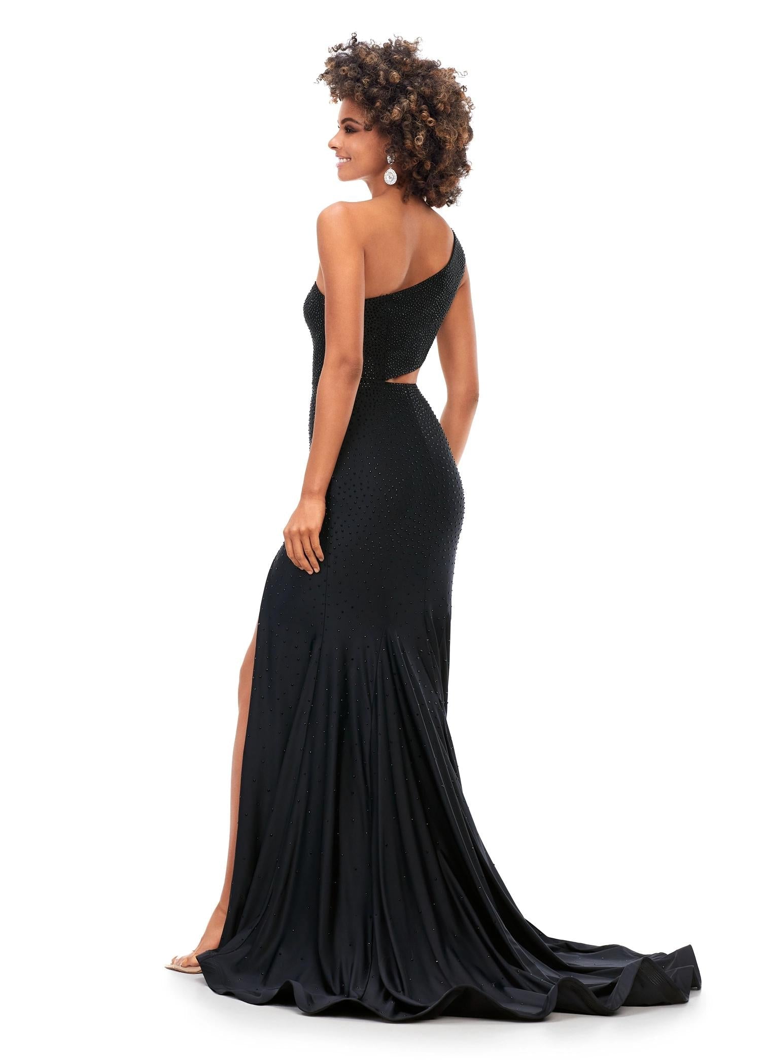 Back. Black ASHLEYlauren 11337 One Shoulder Fitted Jersey Gown Embellished with Heat Set Stones, Asymmetrical Shark Bite Cut Out, and Left Leg Slit