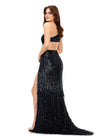 Back. Black ASHLEYlauren 11350 one shoulder hand-beaded gown featuring an asymmetric bead pattern to accentuate curves, feather details near the hemline, and a left leg slit for a bold and glamorous look.