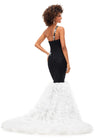 Back. Black/White ASHLEYlauren 11232 elegant tulle gown featuring a ruched one shoulder bustier, scattered appliques, a fit & flare silhouette, and a glitter tulle mermaid ruffle skirt for a stunning and sophisticated look.
