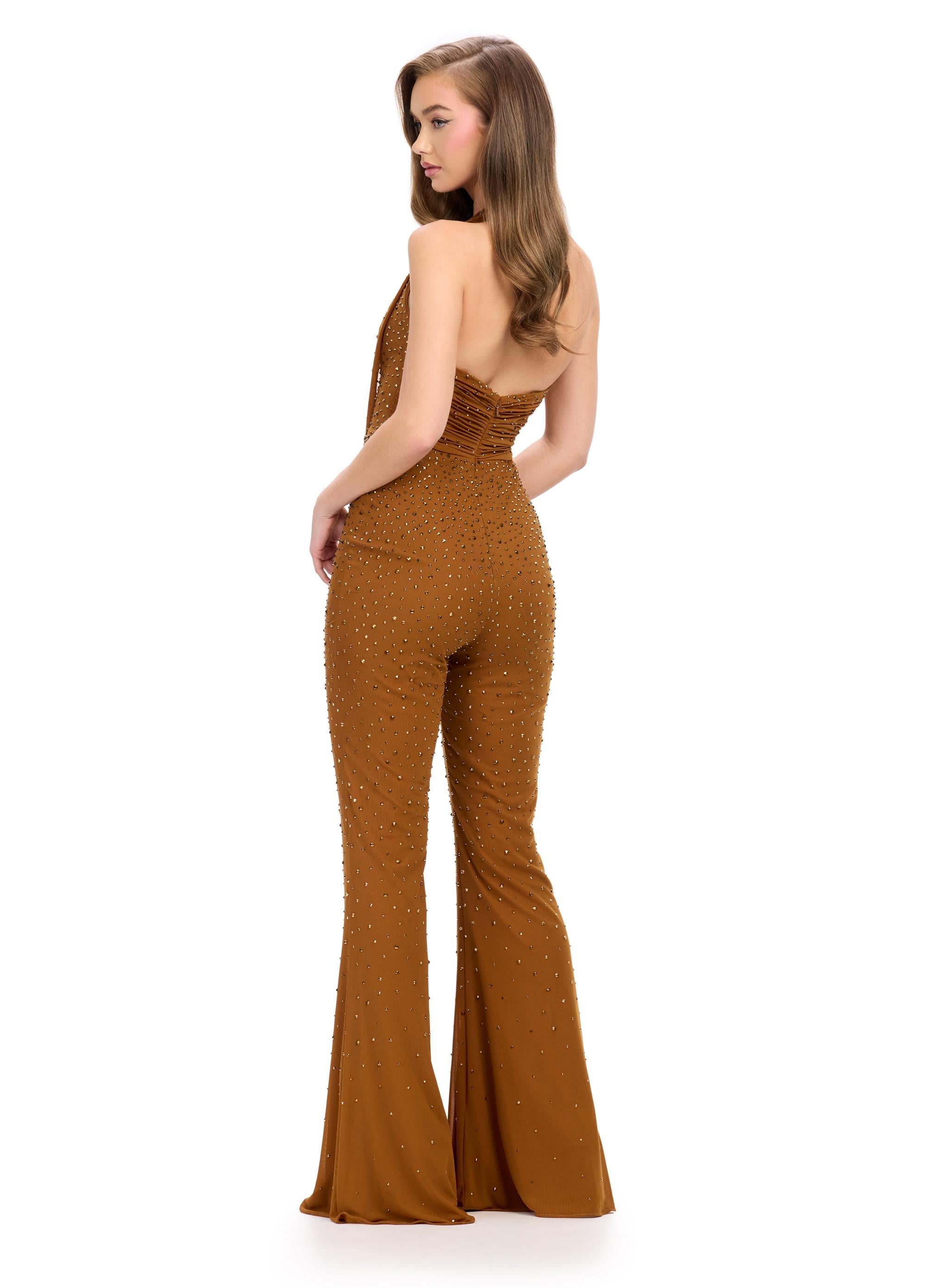 Back. Bronze ASHLEYlauren 11775 standout jumpsuit featuring a halter neckline, illusion deep V-neckline adorned with crystal press-on stones, and a sleek silhouette for a bold and glamorous look.