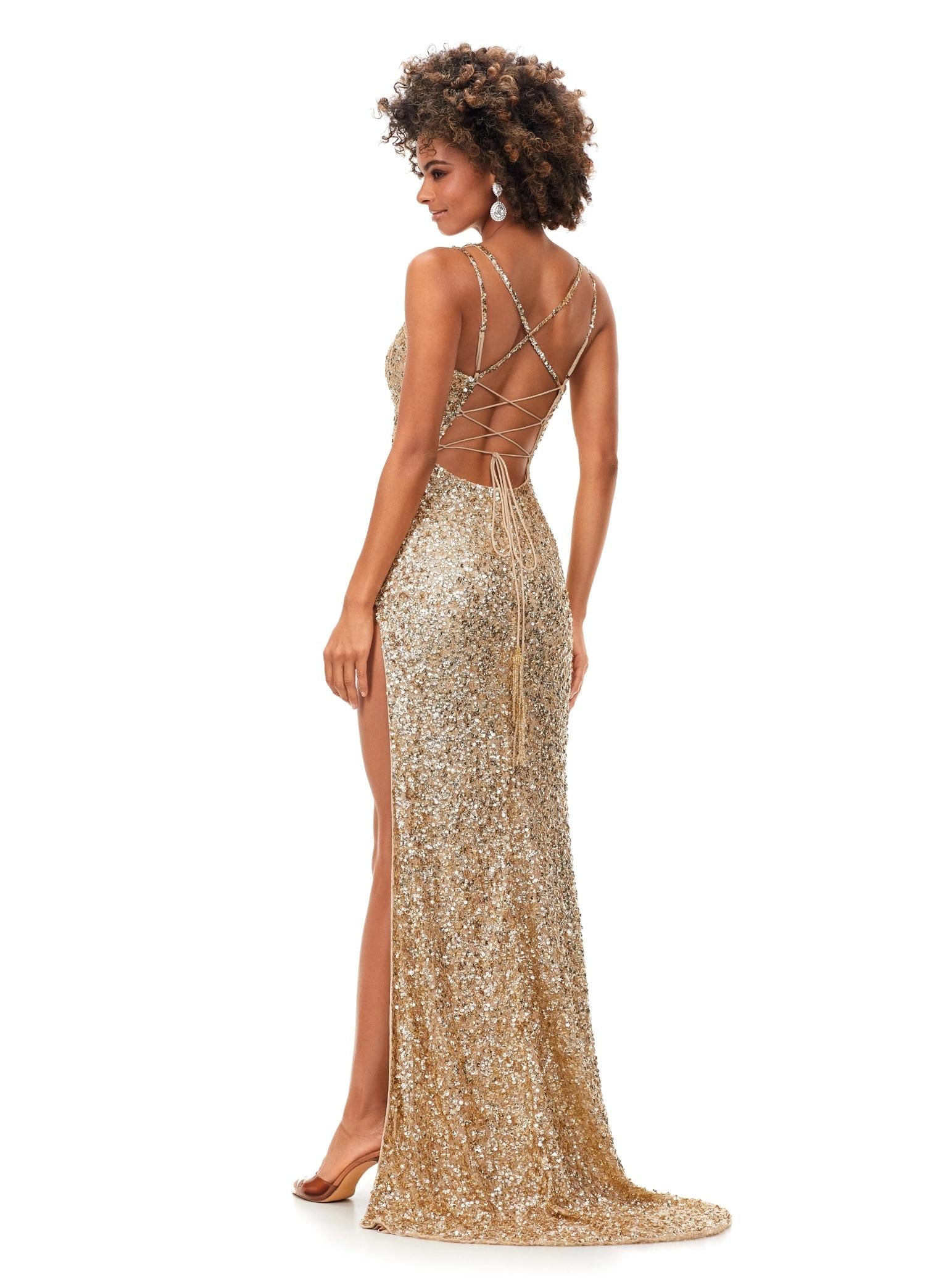 Back. Gold ASHLEYlauren 11342 sequin gown featuring double spaghetti straps, a sweetheart neckline, lace-up back with beaded fringe tassels, and a left leg slit for a glamorous and elegant look.