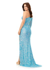 Back. Light Blue ASHLEYlauren 11340 sequin one shoulder gown featuring a single sleeve, shark bite cut-out, wrap skirt, and left leg slit for a striking and glamorous look.