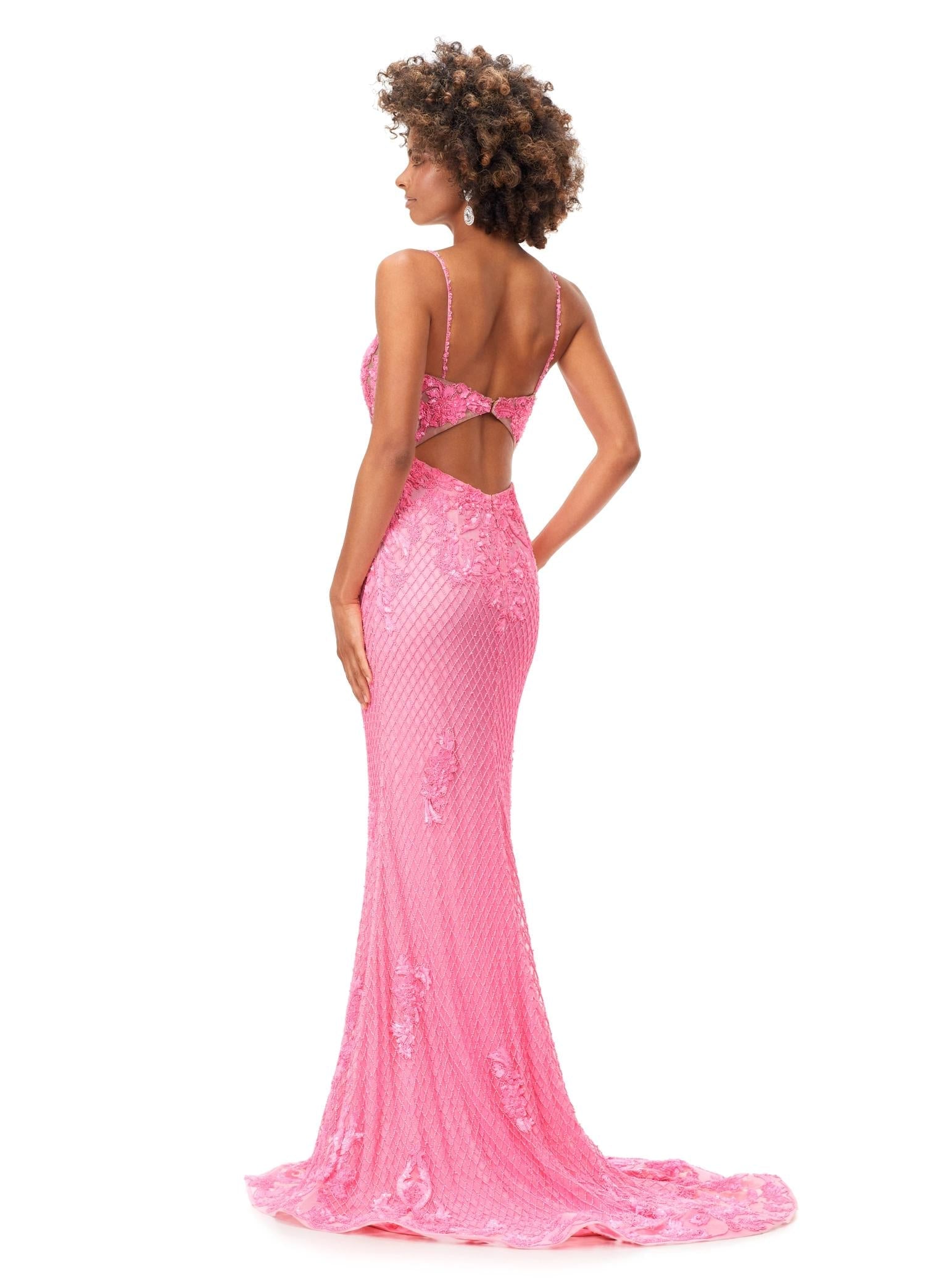 Back. Pink ASHLEYlauren 11362 elegant spaghetti strap gown featuring a sweetheart neckline, sheer illusion bustier adorned with intricate sequin details that cascade onto the skirt and hemline, and a sweep train for a glamorous and sophisticated look.