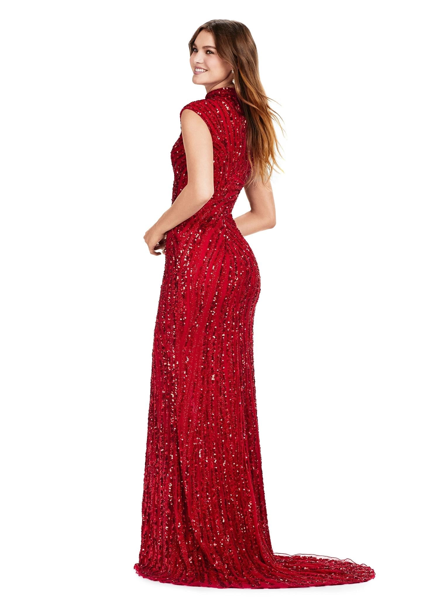 Back. Red ASHLEYlauren 11395 fully beaded sequin gown featuring an intricate beaded motif, high neckline, cap sleeves, and a modest front slit for an elegant and regal look.