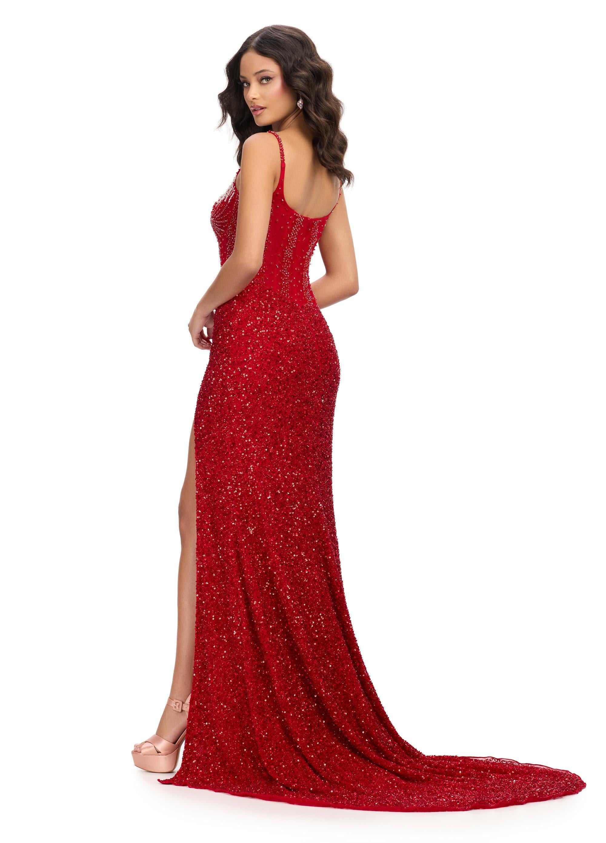 Back. Red ASHLEYlauren 11711 elegant gown featuring a fully hand-beaded bodice, spaghetti straps, corset bustier, illusion neckline, and a left leg slit for a glamorous and sophisticated look.