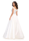 Back. White ASHLEYlauren 11771 elegant Mikado A-line ball gown featuring an off shoulder neckline, unique floral detailing, and a full ball gown skirt for a romantic and sophisticated look.