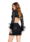 Back - Black ASHLEYlauren 4653 fully beaded cocktail dress featuring a V-neckline, long sleeves trimmed with feathers, bold cutouts, and a fitted skirt for a fun and flirty statement look.