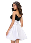 Back - Black/White ASHLEYlauren 4734 strapless stretch velvet cocktail dress featuring a fitted skirt, satin wrap belt, and an A-line satin overskirt for an elegant and sophisticated look.
