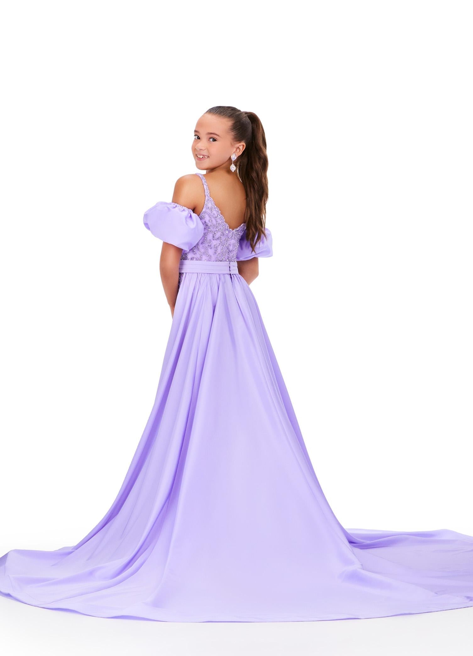 Back - Lilac ASHLEYlauren 8269 fully beaded kids jumpsuit featuring a square neckline, dramatic removable taffeta puff sleeves, and a detachable taffeta overskirt for a bold and versatile statement look.