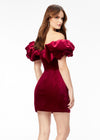 Back - Red ASHLEYlauren 4528 off shoulder stretch velvet cocktail dress featuring an oversized ruffle detail and contoured seaming throughout the fitted skirt for a chic, curve-enhancing look.