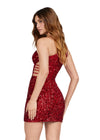 Back - Red ASHLEYlauren 4650 fully sequin cocktail dress featuring a one shoulder neckline, shark bite cut out at the waist with knot details, and a fitted skirt for a bold and glamorous look.