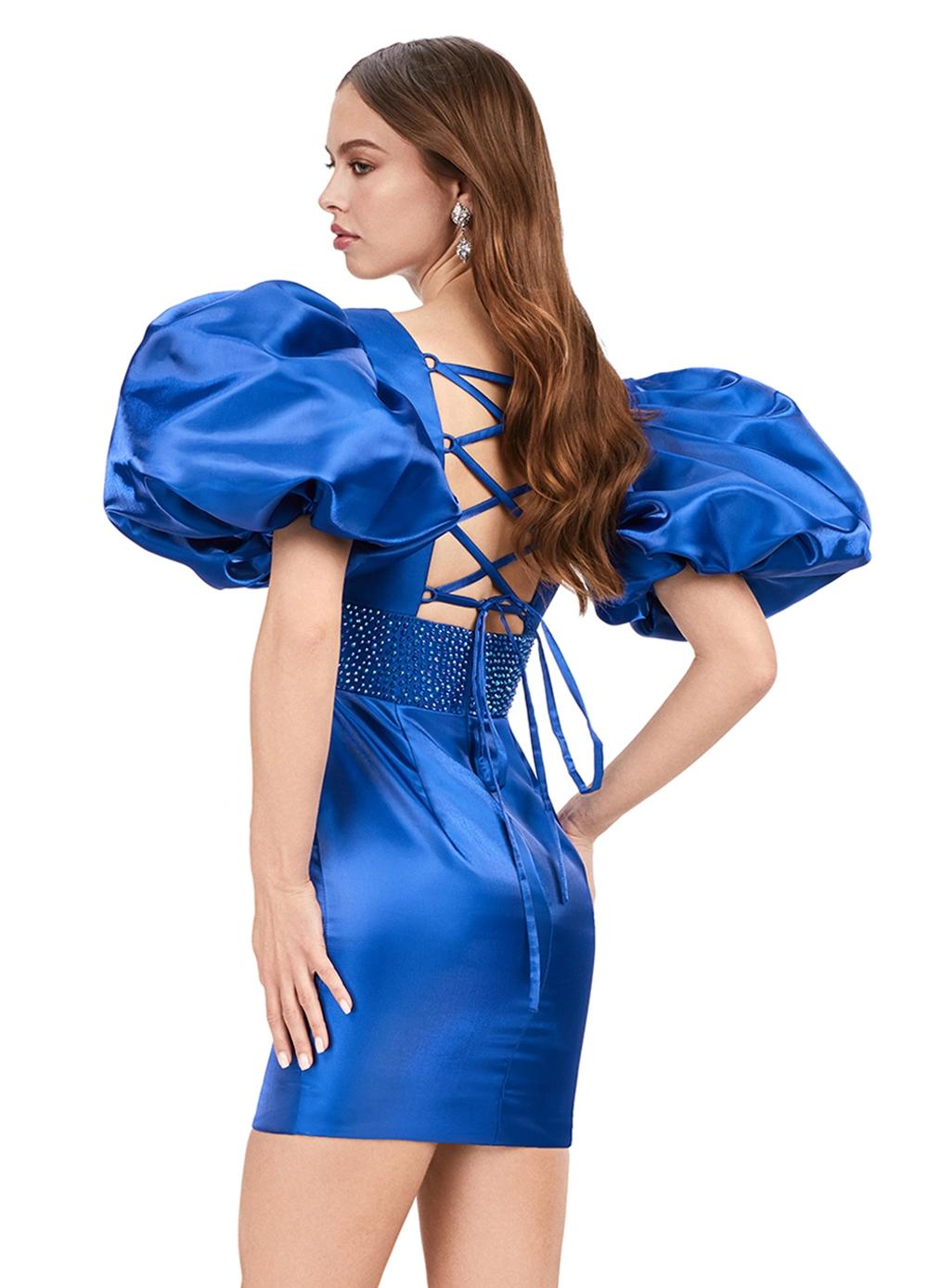 Back - Royal ASHLEYlauren 4549 cocktail dress featuring a V-neckline, oversized puff sleeves, heat set stone-embellished waistband, fitted skirt, and center lace-up back for a bold and glamorous look.