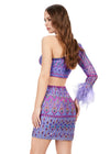 Back - Lilac ASHLEYlauren 4597 fully beaded two-piece set featuring a one sleeve top with feather trim and a matching skirt, adorned with an intricate, bright bead pattern for a bold and standout look.