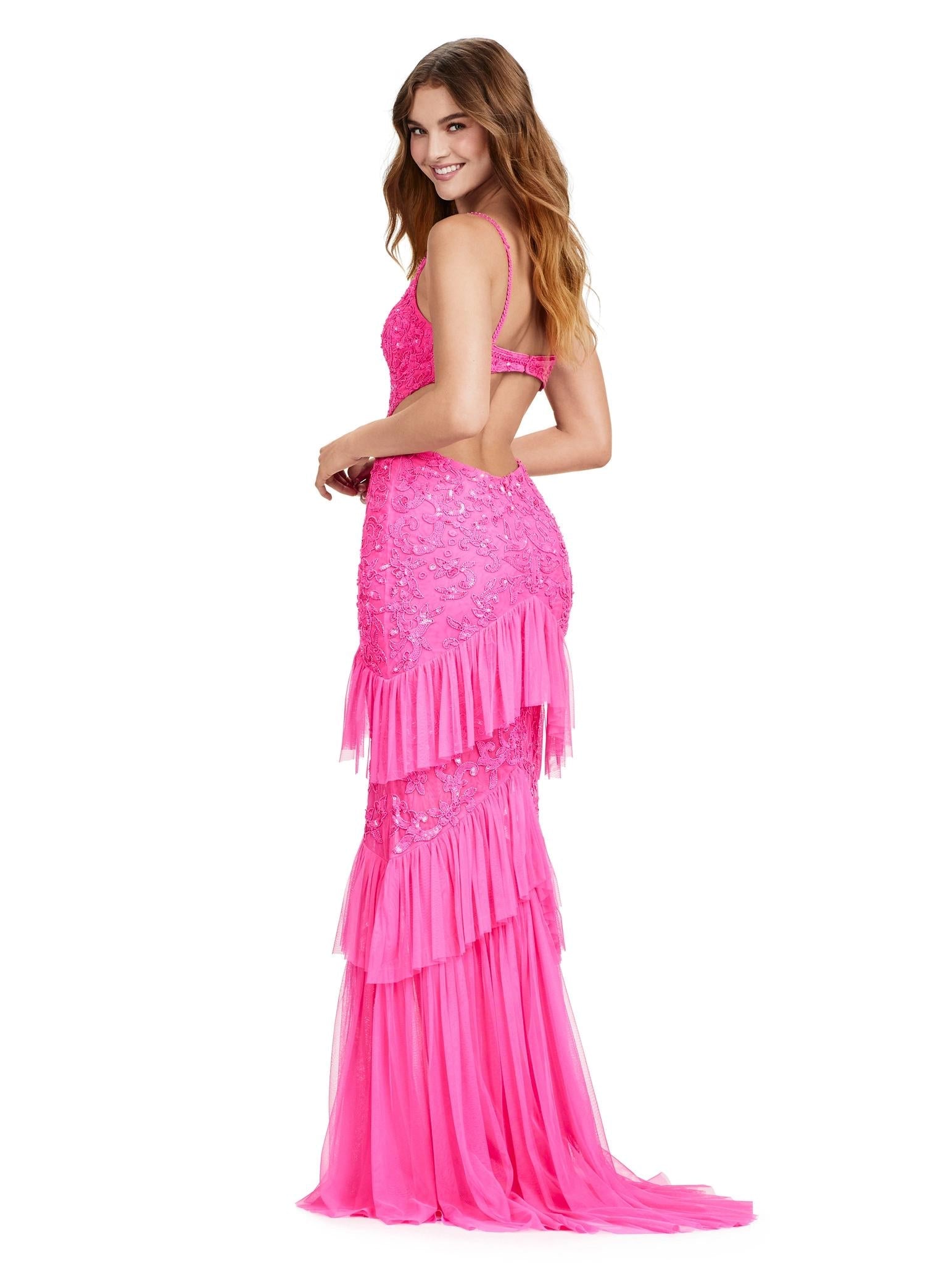 Back view. ASHLEYlauren 11436 pink fully beaded gown with V-neckline, long sleeves, open back, centre slit, and tiered ruffle skirt