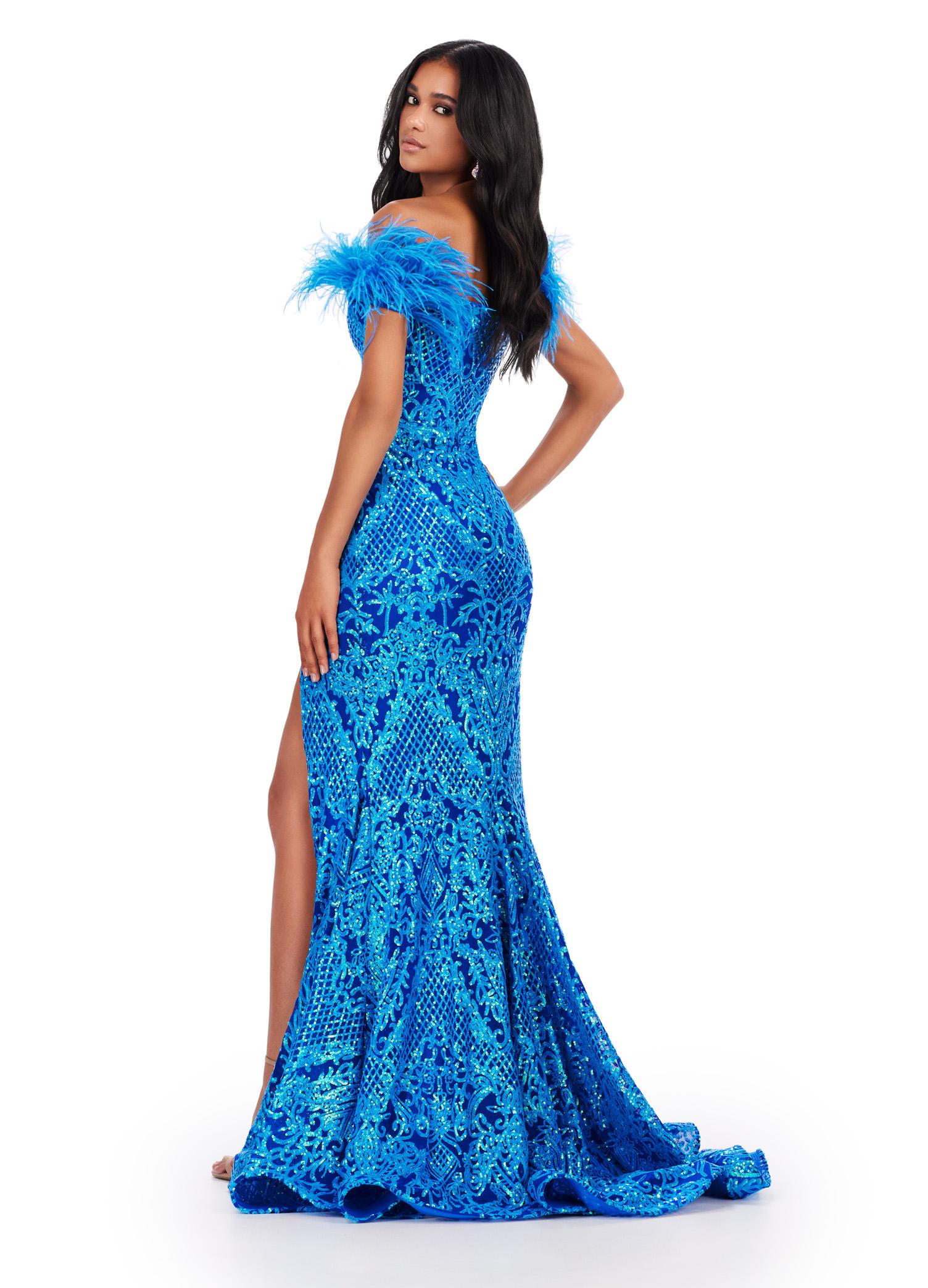 Back view. ASHLEYlauren 11463 Turquoise/Royal sequin gown with sweetheart neckline, feather off shoulder straps, and left leg slit