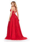 Back view. ASHLEYlauren 11480 red A-line gown with feather and jewel embellishments, corset bodice, lace up back, and left leg slit