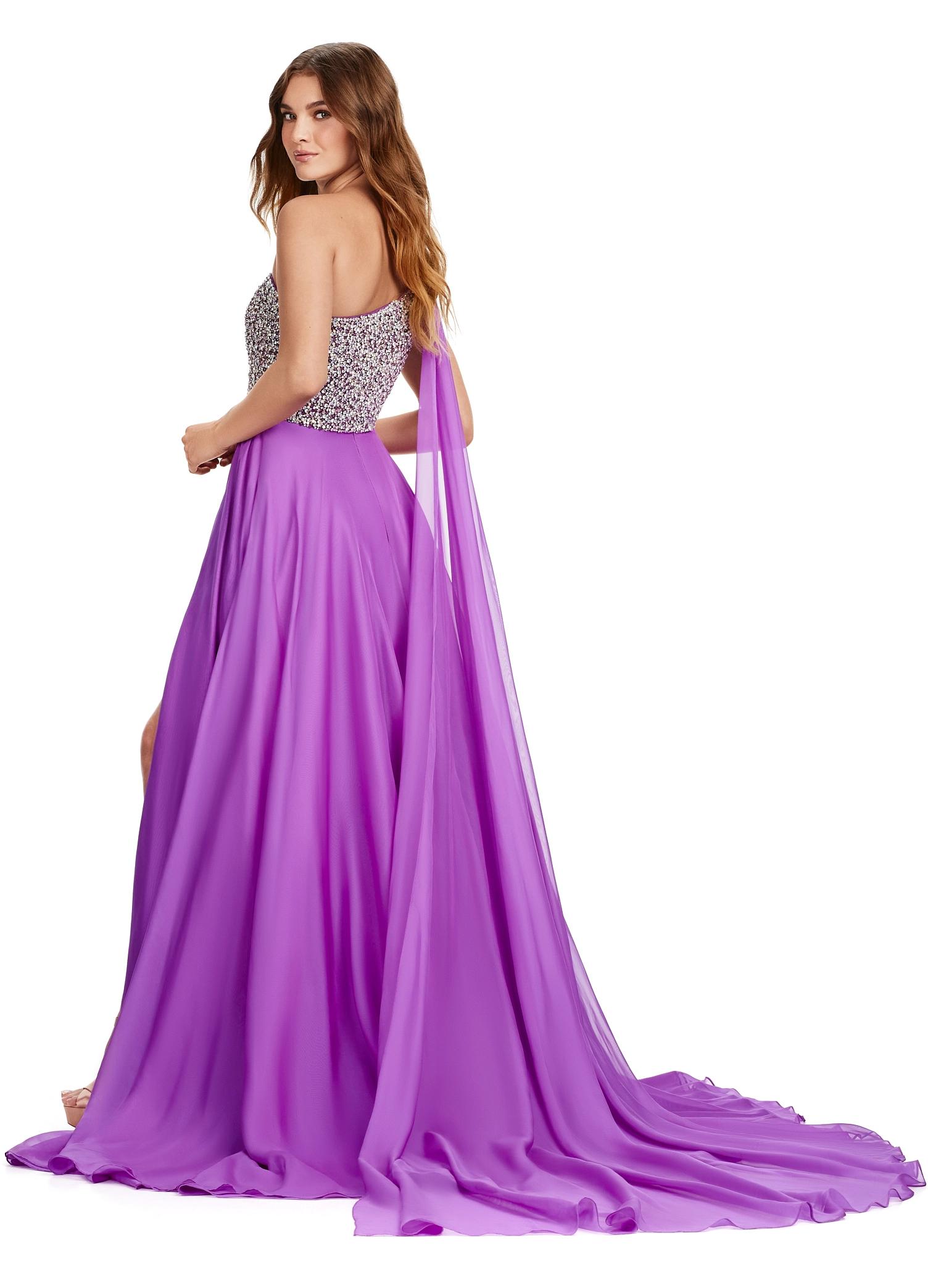 Back view. ASHLEYlauren 11482 purple one shoulder gown with fully beaded bodice, chiffon cape, A-line skirt, and leg slit
