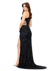 Back view. Black ASHLEYlauren 11288 stunning one shoulder fully hand-beaded gown featuring modern cut outs, criss cross waist straps, a left leg slit, and a sweep train for a bold and statement-making entrance.