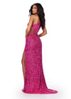 Back view. Fuchsia ASHLEYlauren 11288 stunning one shoulder fully hand-beaded gown featuring modern cut outs, criss cross waist straps, a left leg slit, and a sweep train for a bold and statement-making entrance.